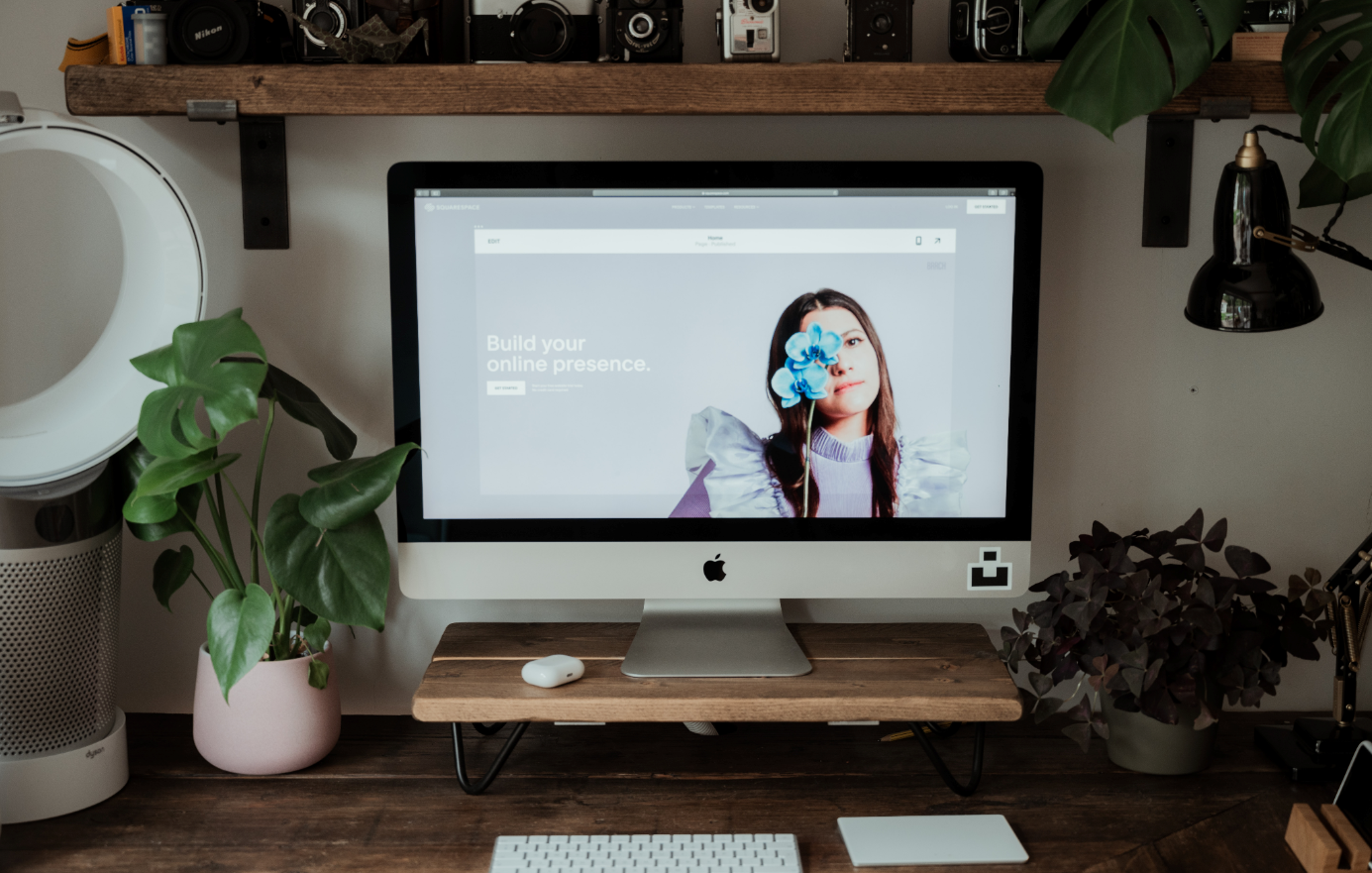 Mac with Squarespace website on screen