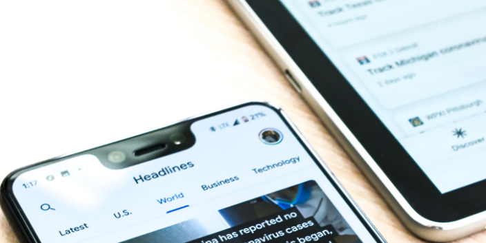 news headlines on cellphone screen